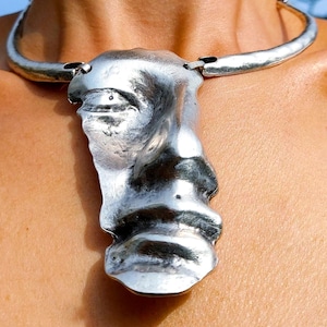 May include: A rustic wooden sign with the text "Welcome to our home" in white lettering. The sign has a distressed finish and a simple, inviting design, ideal for entryway decor.