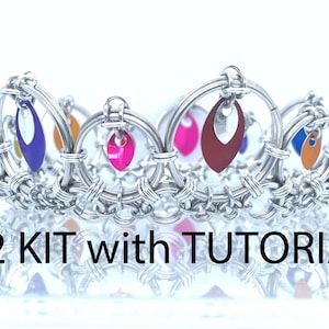 May include: A silver wire crown with colorful teardrop-shaped metal accents. The crown is made with a woven wire technique. The text "X2 KIT with TUTORIAL" is visible below the crown.