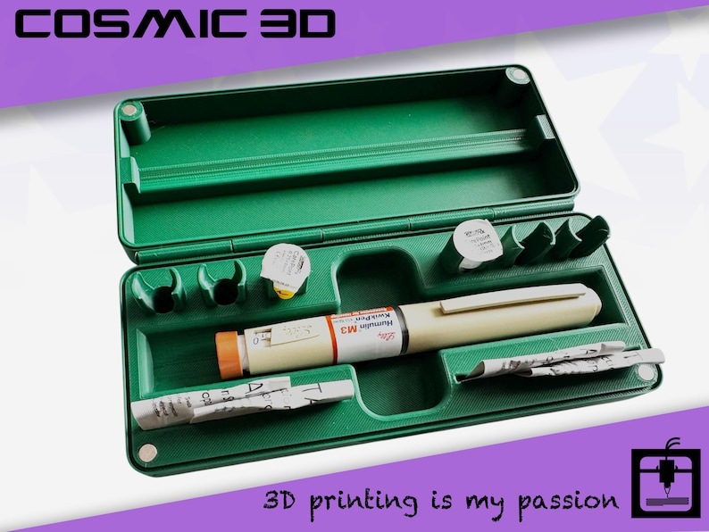 May include: A green plastic case with an open lid, containing medical supplies. Inside are an insulin pen, needles, and other items. The text "COSMIC 3D" is at the top, and "3D printing is my passion" is at the bottom.