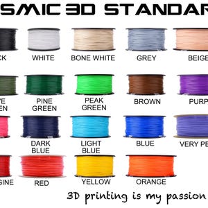 May include: A collection of spools of 3D printing filament in various colors, including black, white, grey, and beige. Other colors include green, blue, pink, and yellow. The text "COSMIC 3D STANDARD" is at the top, and "3D printing is my passion" is at the bottom.