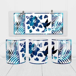May include: Three white ceramic mugs with a blue and white tropical design. The design features a hummingbird, hibiscus flowers, and palm leaves.
