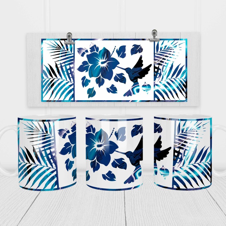 May include: Three white ceramic mugs with a blue and white tropical design. The design features a hummingbird, hibiscus flowers, and palm leaves.