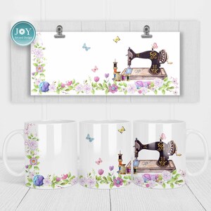 May include: White ceramic mug featuring a floral design and a vintage sewing machine with spools of thread and butterflies. The mug has a handle and is ideal for coffee or tea.