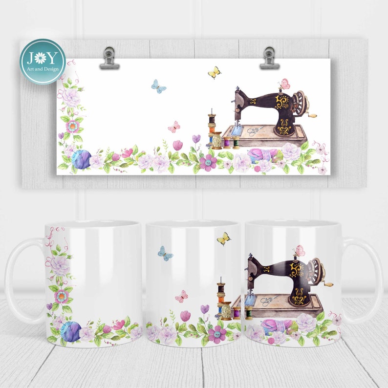 May include: White ceramic mug featuring a floral design and a vintage sewing machine with spools of thread and butterflies. The mug has a handle and is ideal for coffee or tea.