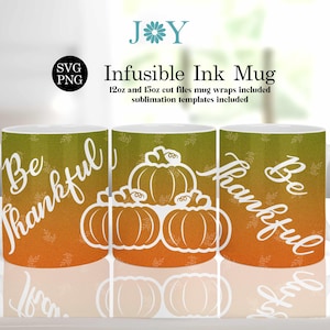 May include: Three white ceramic mugs with a fall theme. The mugs have a gradient background of orange and green with white leaves and the text "Be Thankful". The mugs are decorated with white pumpkin silhouettes.