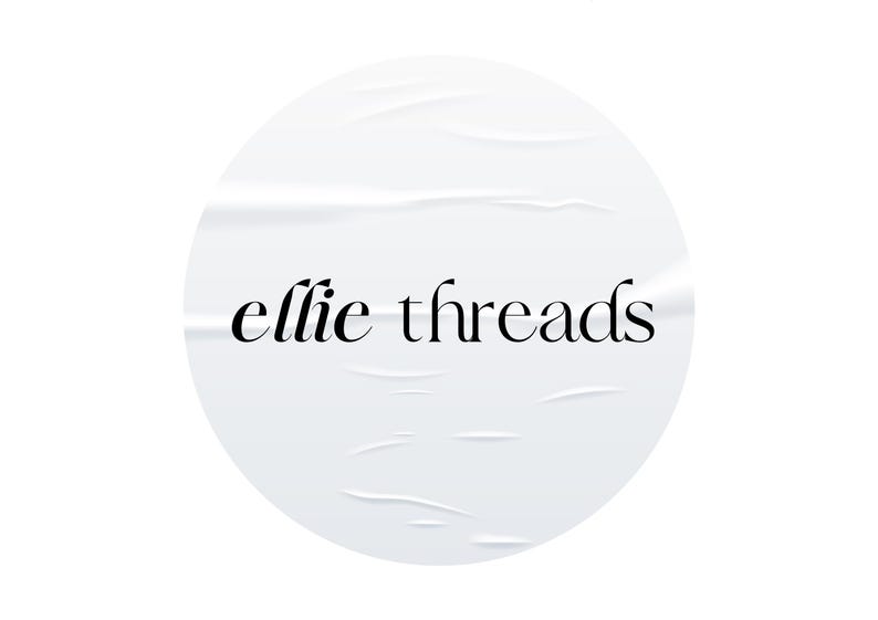 May include: White circle sticker with a wrinkled texture and the text "ellie threads" in black.