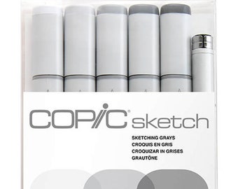 May include: A package of Copic Sketch markers in a clear plastic case. The markers are various shades of gray, with gray caps and white barrels. The package includes the text "COP/C sketch" and "SKETCHING GRAYS".
