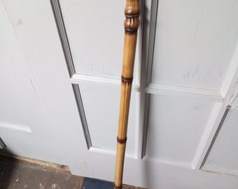 Flame Cured Bamboo Walking Stick w/Chrome Collared rubber stopper cane tip that screws off to reveal 3" metal spike tip. 35.5" x 1"