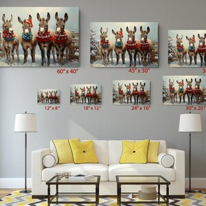 a living room filled with furniture and pictures on the wall
