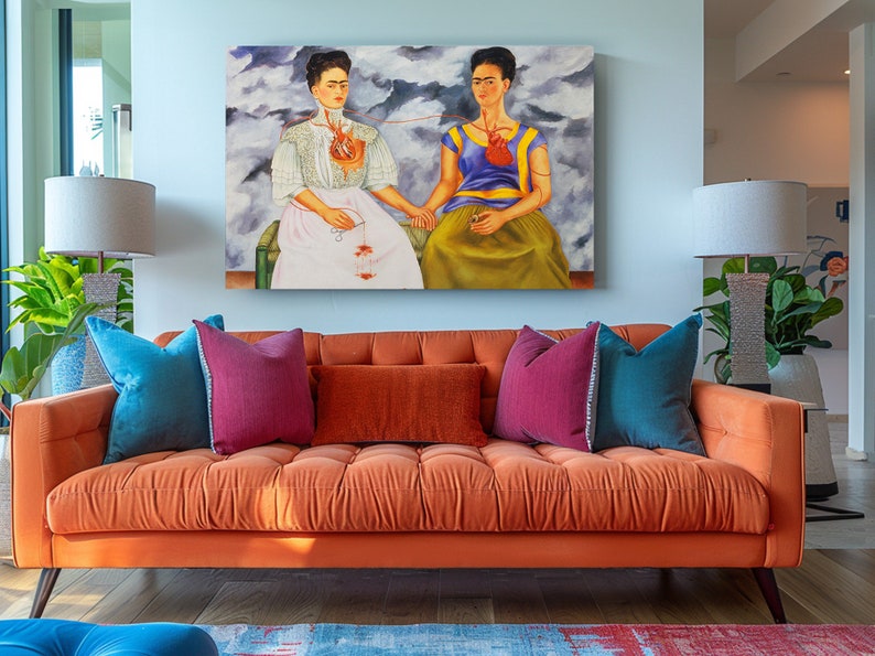 a living room with a couch and a painting on the wall