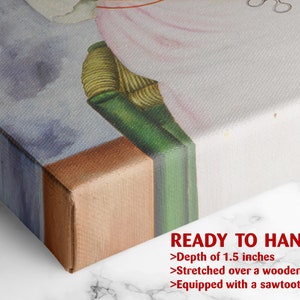a close up of a bed with a painting on it