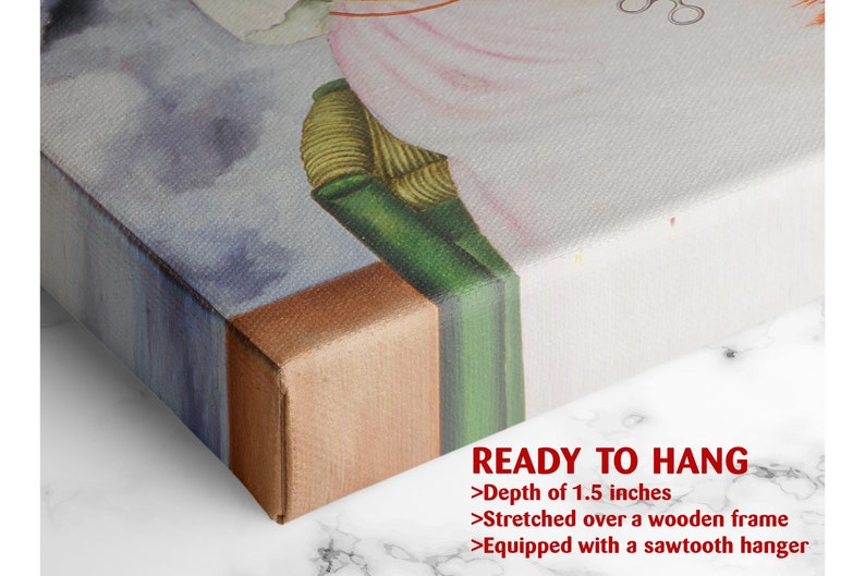a close up of a bed with a painting on it