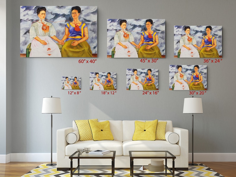 a living room filled with furniture and paintings on the wall