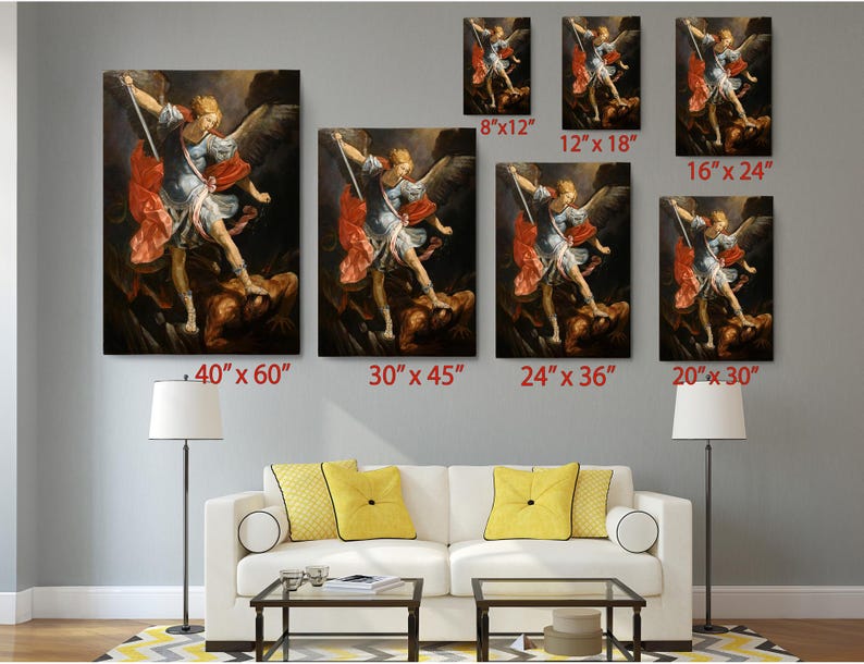 a living room with a white couch and paintings on the wall