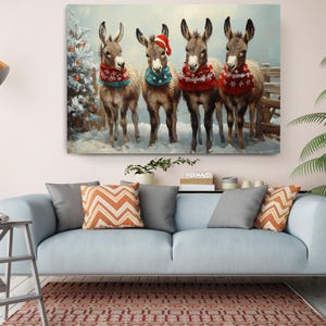 a painting of three donkeys wearing christmas sweaters