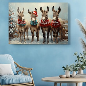 a painting of three donkeys wearing christmas sweaters