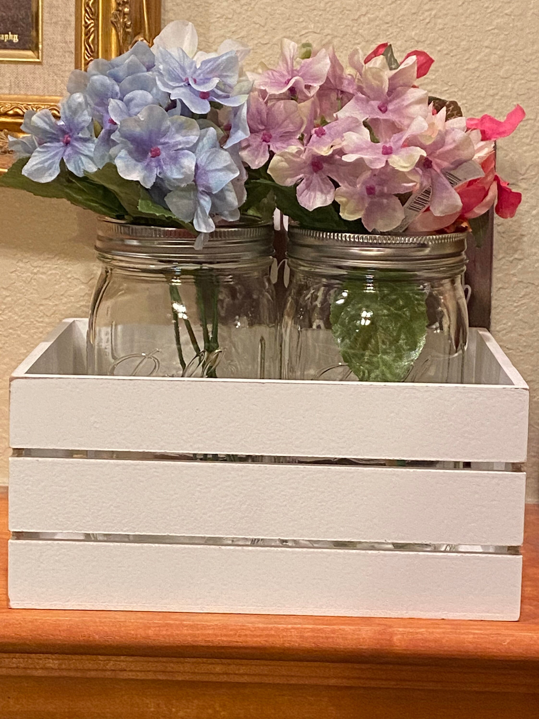 2 30oz mason jars with silk flowers in a wooden crate. Buyer Etsy