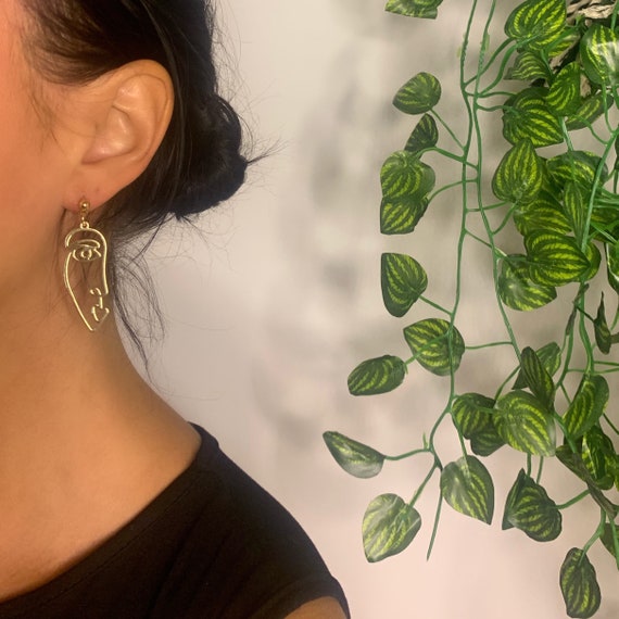 Half face earrings deals