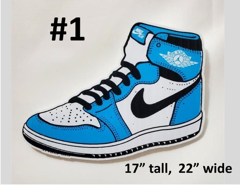 May include: A blue and white Air Jordan 1 sneaker with a black swoosh and a white wing logo. The sneaker is 17 inches tall and 22 inches wide.
