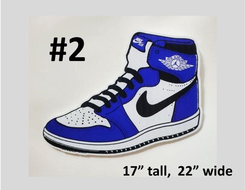 May include: Blue and white Air Jordan sneaker with a black swoosh and the text "Air Jordan" on the side. The sneaker is 17 inches tall and 22 inches wide.
