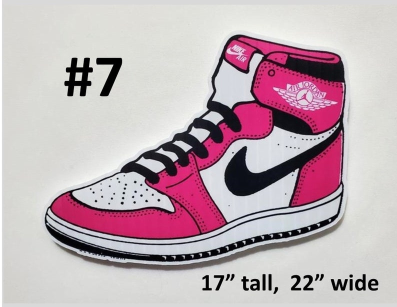 May include: A pink and white Air Jordan sneaker with a black swoosh and the text "AIR JORDAN" on the side. The sneaker is 17 inches tall and 22 inches wide.