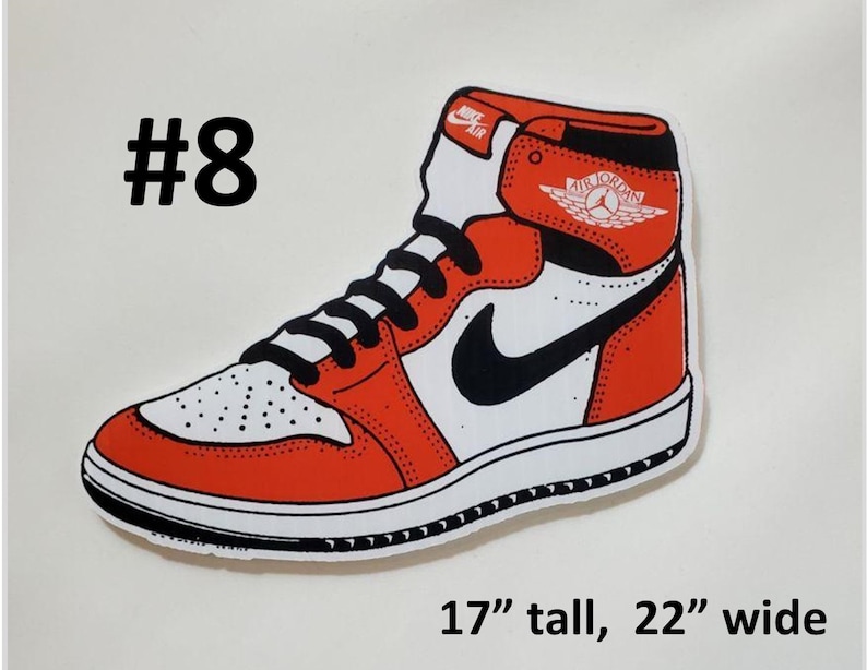 May include: A red and white Air Jordan sneaker with a black swoosh and a red and white Air Jordan logo. The sticker is 17 inches tall and 22 inches wide.