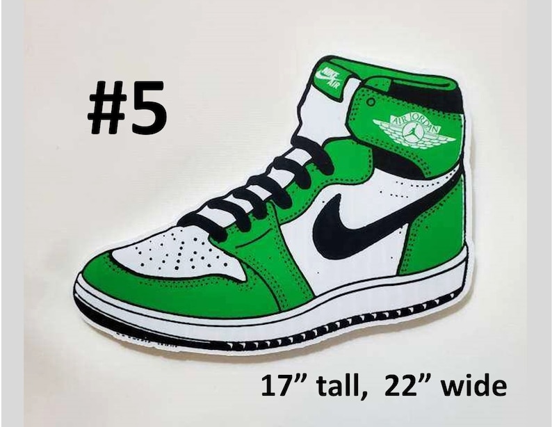 May include: Green and white Air Jordan sneaker with a black swoosh and the text "Air Jordan" on the side. The sneaker is 17 inches tall and 22 inches wide.