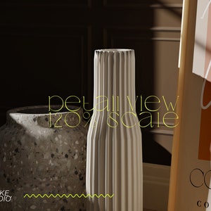 May include: Two ceramic vases, one with a textured surface and the other with a ribbed design. The vases are on a wooden surface with a framed print that says "Color" and "Contemporary" in the background.