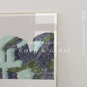 May include: A framed abstract art print with a gold frame and a white mat. The print features a colorful abstract design with shades of blue, green, and white. The text "FRAME MATERIAL GOLD & GLASS" is printed on the print.