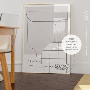 May include: A minimalist art print with a geometric design in black and white. The print is framed in gold and has the text "CRAYON" and "STYKKE*STUDIO" at the bottom. The text "INSERT YOUR DESIGN THROUGH SMART LAYER (PHOTOSHOP DESKTOP)" is in the upper right corner.