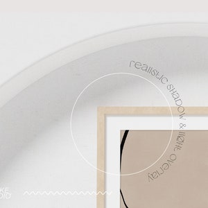 May include: A framed abstract art print with a beige background and black lines. The text "realistic shadow & light overlay" is written in a circle around the frame.