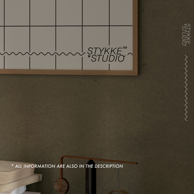 May include: A framed white grid poster with the text "STYKKE&trade; *STUDIO" at the bottom. The poster is hanging on a textured brown wall.