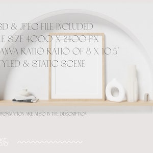 May include: A white wall with a wooden shelf and a framed print. The shelf is decorated with a white vase, a white ceramic object, and a stack of books. The text on the wall reads "* PSD & JPEG FILE INCLUDED * FILE SIZE 4000 X 2400 PX * CANVA RATIO RATIO OF 8 X 10.5" * STYLED & STATIC SCENE * ALL INFORMATION ARE ALSO IN THE DESCRIPTION STYKKE *STUDIO"