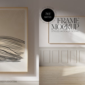 May include: A gold framed mockup of a 7x5 inch ratio frame in a white room with white wainscoting and wood floors. The text "FRAME MOCKUP" and "STYLED MOCKUP SCENE" is visible on the frame.