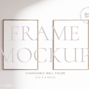May include: Two rectangular wooden picture frames with white interiors are displayed against a white wall. The word "FRAME MOCKUP" is overlaid in a light purple font. The text "CHANGEABLE WALL COLOR" and "DIN A 4 RATIO" are also visible.