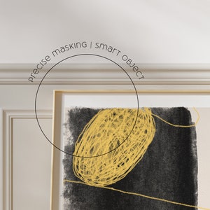 May include: A framed abstract art print with a black background and a yellow, scribbled circle in the center. The text "precise masking | smart object" is written in a circle above the print.
