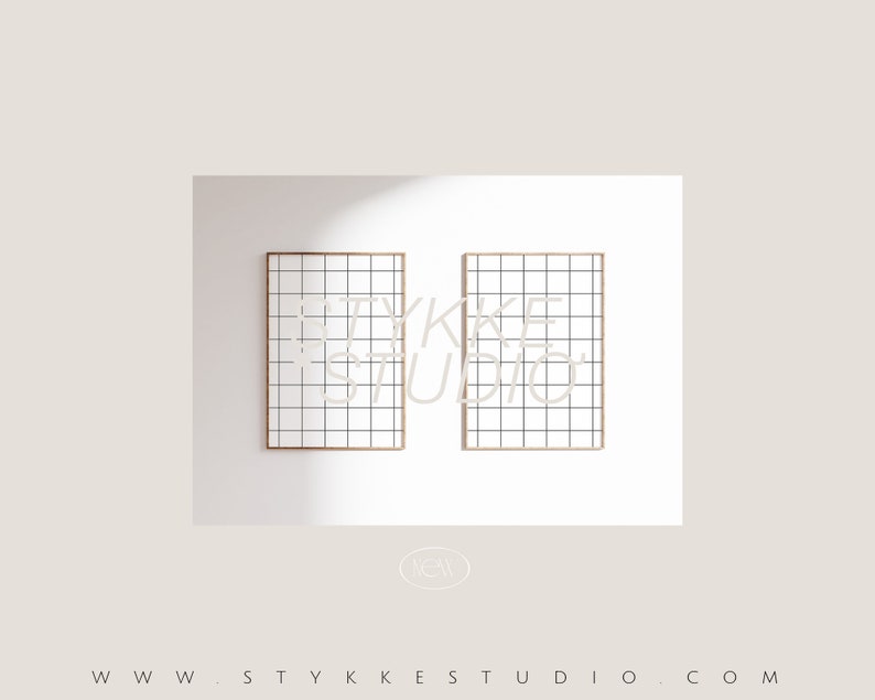 May include: Two framed prints with a grid pattern and the text "YKKE STUDIO" in a light beige color. The frames are a light brown color, and the background is white.