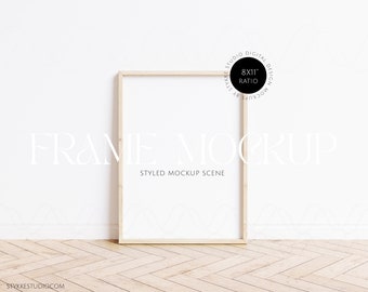 May include: A wooden frame mockup with a white background. The frame is 8x11 inches and is sitting on a light wood floor.