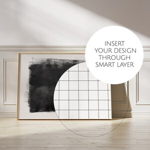 May include: A black and white abstract art print with a grid pattern in a white frame. The text "INSERT YOUR DESIGN THROUGH SMART LAYER" is on a white circle.