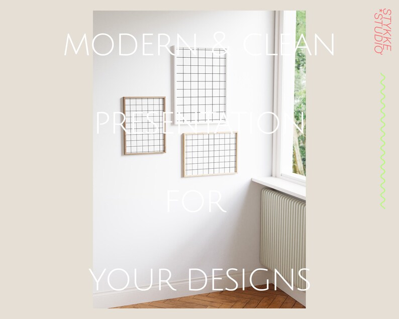 May include: A white wall with three wooden picture frames. The frames are empty and have a grid pattern. The text "MODERN & CLEAN PRESENTATION FOR YOUR DESIGNS" is written on the wall.