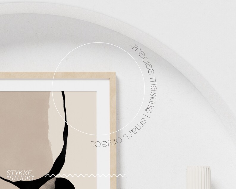 May include: A framed abstract art print with black and beige shapes and a wavy line at the bottom. The print has the text "STYKKE STUDIO" in the bottom left corner.