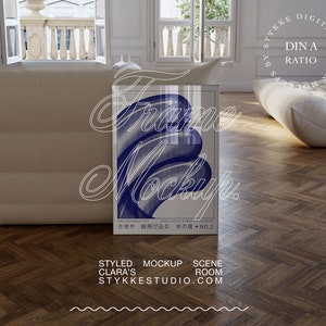 Digital frame mockup DIN A size with print poster inside on wooden floor in modern interior surrounding of french vintage villa and togo designer sofa in beige.