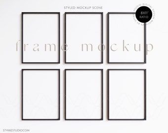 May include: Six black picture frames with white mounts are arranged in a grid pattern on a white wall. The frames are all the same size and are arranged in two rows of three. The frames are empty and ready for photos or artwork. The text "frame mockup" is written in the center of the image.