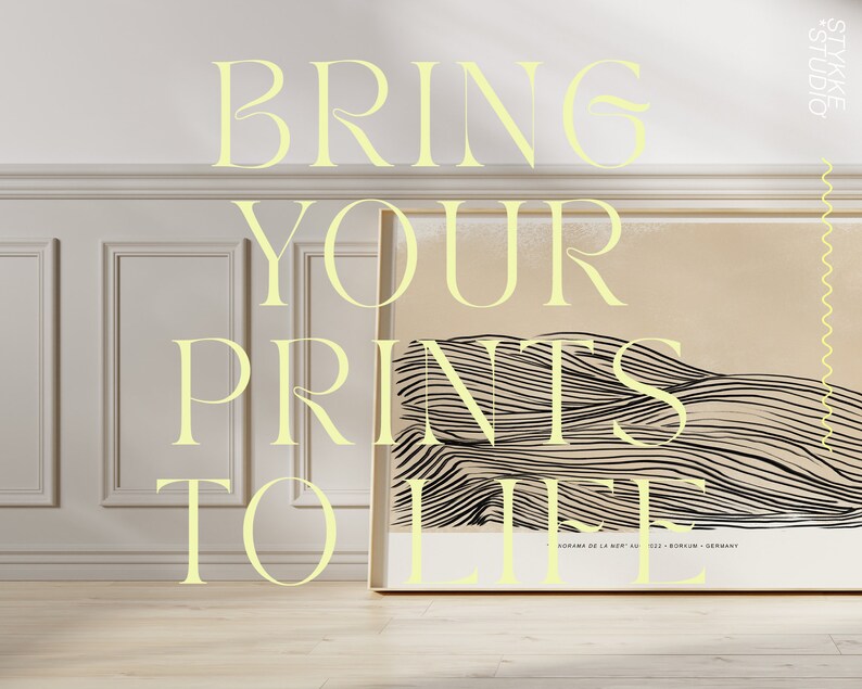 May include: A white wall with a framed print of a black and white abstract design. The print is titled "SORANA DE LA NISP" and is from Berlin, Germany. The text "BRING YOUR PRINTS TO LIFE" is written in yellow letters on the wall.