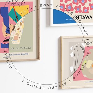 May include: Three framed art prints with abstract designs in pink, blue, green, and brown. The prints are hung on a white wall. The text on the prints reads "Matisse", "prepared SMART OBJECTS", "DE LA NATURE", "L'universit&eacute;, Paris-VII", "easy TO Use", "OTTAWA", "OCKUP", "F", "TERY WORKS", "I olan DOHSOLOHD J".
