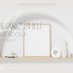 May include: A white wall with a half-circle archway. A wooden shelf with a white frame, a white vase, and a white ceramic object sits inside the archway. The text "THE ARC SHELF FRAME MOCKUP 8 X 10.5" RATIO" is written on the wall.