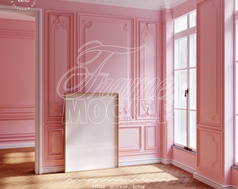 May include: A white picture frame mockup in a pink room with white trim and ornate moulding. The room has a large window with white trim and a wooden floor.