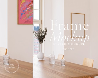 May include: A styled mockup scene featuring a wooden table with two chairs, a vase with dried flowers, a glass bottle, and two glasses. A framed picture hangs on the wall behind the table. The text "Frame Mockup" is written in white on the wall.