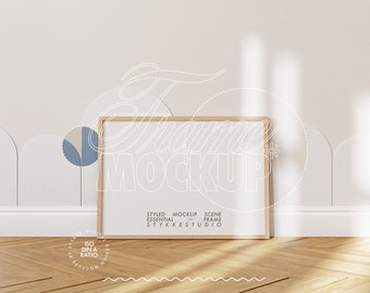 May include: A wooden frame mockup with a white background and a wooden floor. The frame is empty and ready for your design. The text "STYKKESTUDIO" is visible at the bottom of the frame.