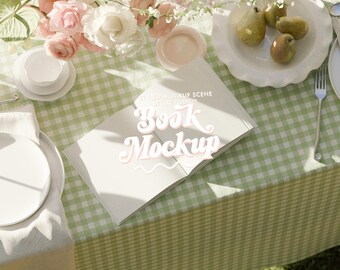 open book mockup hardcover square, laying book mockup feminine gingham floral flatlay sunlight, countryside aesthetic, layout mockup planner